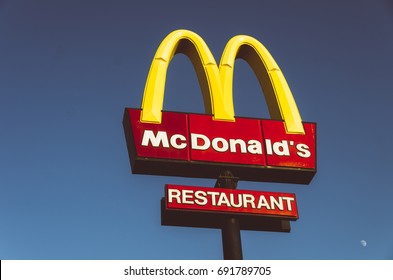 AYIA NAPA, CYPRUS - SEP13: Sign with McDonald's logo against blue sky. on September 13th, 2013 in Ayia Napya, Cyprus. 