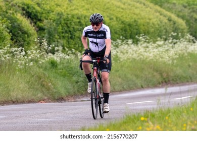 Aylesbury,Bucks,UK - May 15th 2022. Cyclist Dressed In Lycra On A Country Road