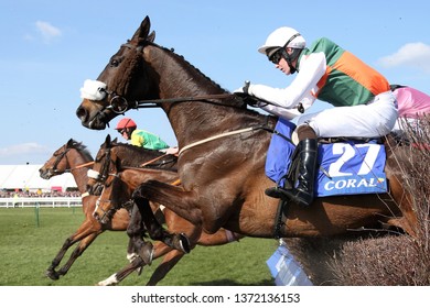 AYR RACECOURSE, AYRSHIRE, SCOTLAND, UK : 13 APRIL 2019 : Racehorse Doing Fine Ridden By Jockey Sean Bowen Jumps A Fence Whilst Running In The 2019 Scottish Grand National