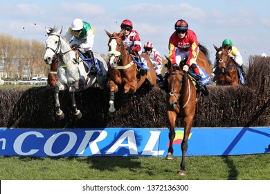 AYR RACECOURSE, AYRSHIRE, SCOTLAND, UK : 13 APRIL 2019 : Vintage Clouds, Geronimo And Cogry Jump The Last Fence On The First Circuit During The Scottish Grand National