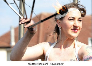 AYR RACECOURSE, AYRSHIRE, SCOTLAND, UK : 12 APRIL 2019 : A Fire Eater Performs Outside The Racecourse And Entertains The Crowds Before The Scottish Grand National Meeting At Ayr Racecourse