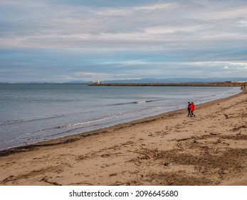 Ayr, South Ayrshire, Scotland - December 25th 2021: People Out Walking On Ayr Beach Christmas Day.