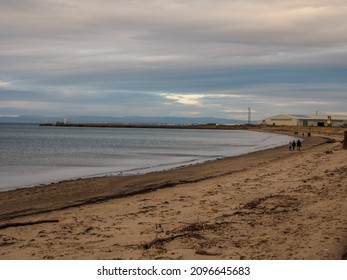 Ayr, South Ayrshire, Scotland - December 25th 2021: People Out Walking On Ayr Beach Christmas Day.