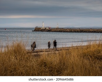 Ayr, South Ayrshire, Scotland - December 25th 2021: People Out Walking On Ayr Beach Christmas Day.