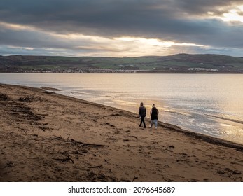 Ayr, South Ayrshire, Scotland - December 25th 2021: People Out Walking On Ayr Beach Christmas Day.