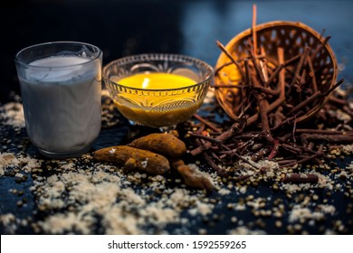 Ayurvedic Blood Purifier And Skin Glow Face Mask Consisting Of Manjistha, Mung Bean, Haldi/turmeric, And Milk. Horizontal Shot Of Face Mask With Entire Constituents With It On Black Surface.