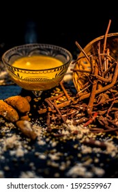 Ayurvedic Blood Purifier And Skin Glow Face Mask Consisting Of Manjistha, Mung Bean, Haldi/turmeric, And Milk. Vertical Shot Of Face Mask With Entire Constituents With It On Black Surface.