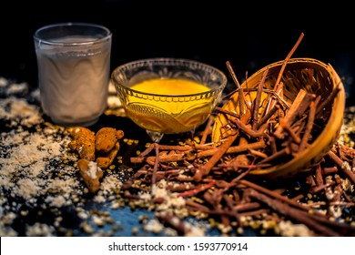 Ayurvedic Blood Purifier And Skin Glow Face Mask Consisting Of Manjistha, Mung Bean, Haldi/turmeric, And Milk. Horizontal Shot Of Face Mask With Entire Constituents With It On Black Surface.