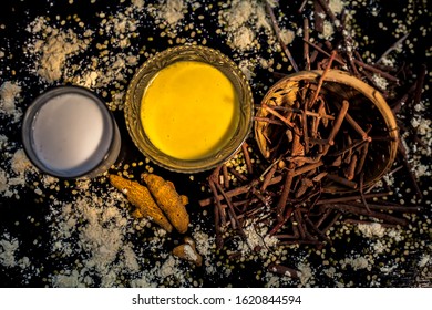 Ayurvedic Blood Purifier And Skin Glow Face Mask Consisting Of Manjistha, Mung Bean, Haldi/turmeric, And Milk. Horizontal Shot Of Face Mask With Entire Constituents With It On A Black Surface.