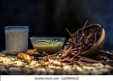 Ayurvedic Blood Purifier And Skin Glow Face Mask Consisting Of Manjistha, Mung Bean, Haldi/turmeric, And Milk. Horizontal Shot Of Face Mask With Entire Constituents With It On A Black Surface.