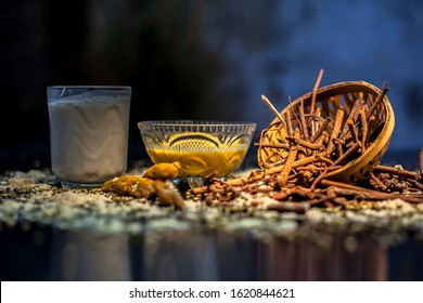 Ayurvedic Blood Purifier And Skin Glow Face Mask Consisting Of Manjistha, Mung Bean, Haldi/turmeric, And Milk. Horizontal Shot Of Face Mask With Entire Constituents With It On A Black Surface.