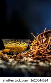 Ayurvedic Blood Purifier And Skin Glow Face Mask Consisting Of Manjistha, Mung Bean, Haldi/turmeric, And Milk. Horizontal Shot Of Face Mask With Entire Constituents With It On A Black Surface.