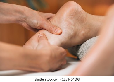 Ayurvedic Foot Massage. Ayurveda Practitioner Pressing Meridian Points On Female Foot