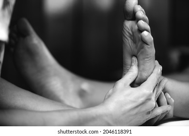 Ayurvedic Reflexology Foot Massage, Ayurveda Practitioner Pressing Meridian Points On Female Foot.