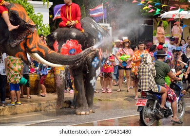 AYUTTAYA, THAILAND - APRIL 13, 2015: Songkran Festival is celebrated in a traditional New Year's Day,People enjoy with the splashing water with elephants in Ayutthaya, Thailand.