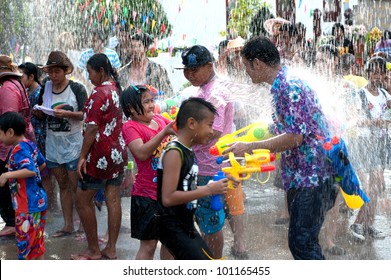 AYUTTAYA,THAILAND-APRIL 13: unidentified People celebrating Songkran (Thai new year / water festival) child and his water gun on road April 13, 2012 in Ayuttaya, Thailand.
