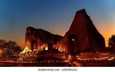 Ayutthaya - 19 February 2019 During The Evening Time At A Temple In Ayutthaya. People Come To Walk Around The Church With Candles. To Remember The Buddha By Walking On The Right Side Of The Church