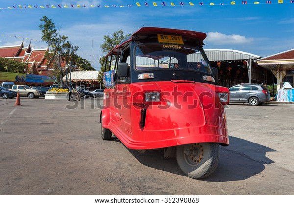 AYUTTHAYA, THAILAND - 5 DEC\
2015: Tuk-Tuk parking in front of temple. It\'s a popular\
transportation for tourist in Ayutthaya historical city. on\
December 5 2015 in\
Ayutthaya