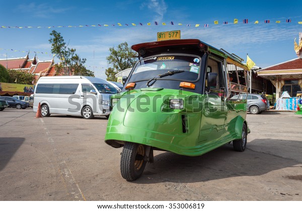 AYUTTHAYA, THAILAND - 5 DEC\
2015: Tuk-Tuk parking in front of temple. It\'s a popular\
transportation for tourist in Ayutthaya historical city. on\
December 5 2015 in\
Ayutthaya