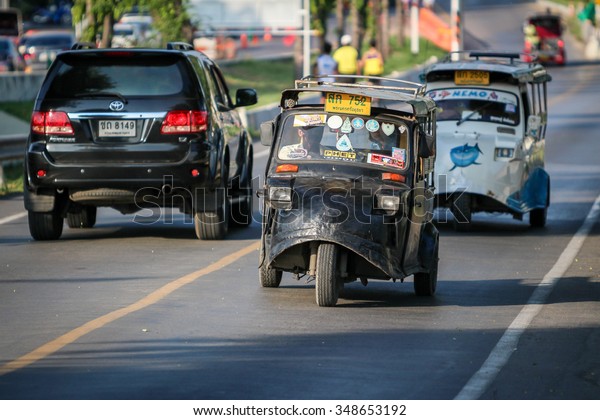 AYUTTHAYA,\
THAILAND - 6 DEC 2015: Tuk-Tuk driving on the road. It\'s a popular\
transportation for tourist in Ayutthaya historical city. on\
December 6 2015 in Ayutthaya\
Thailand.