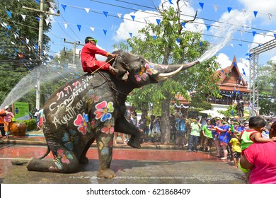 AYUTTHAYA THAILAND - APRIL 13 : Elephant and peples are splashing water in Songkran festival on 13 April 2017 in Ayuthaya Thailand . It's like the New Year's Day 