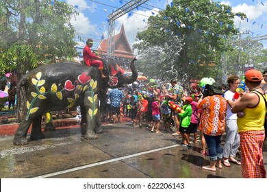 AYUTTHAYA THAILAND - APRIL 13 : Elephant And People Are Splashing Water In Songkran Festival On 13 April 2017 In Ayuthaya Thailand . It's Like New Year's Day 