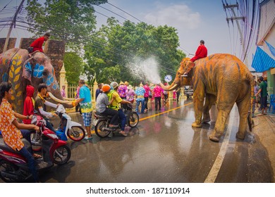 AYUTTHAYA, THAILAND - APRIL 13: Songkran Festival is celebrated in a traditional New Year's Day from April 13 to 15, with the splashing water with elephants on April 13, 2014 in Ayuttaya, Thailand. 