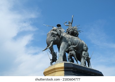 Ayutthaya, Thailand - July 28, 2022: Queen Suriyothai Monument, That Depicts A Fierce Looking King Maha Chakkraphat On His War Elephant, Surrounded By Siamese Soldiers With Clouds And Blue Sky.