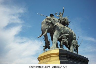 Ayutthaya, Thailand - July 28, 2022: Queen Suriyothai Monument, That Depicts A Fierce Looking King Maha Chakkraphat On His War Elephant, Surrounded By Siamese Soldiers With Clouds And Blue Sky.