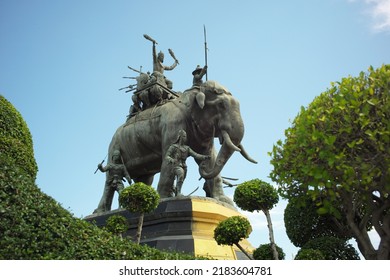 Ayutthaya, Thailand - July 28, 2022: Queen Suriyothai Monument, That Depicts A Fierce Looking King Maha Chakkraphat On His War Elephant, Surrounded By Siamese Soldiers With Clouds And Blue Sky.