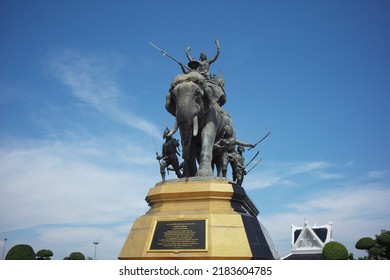 Ayutthaya, Thailand - July 28, 2022: Queen Suriyothai Monument, That Depicts A Fierce Looking King Maha Chakkraphat On His War Elephant, Surrounded By Siamese Soldiers With Clouds And Blue Sky.