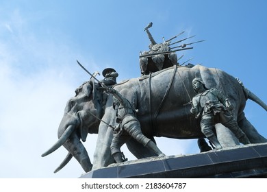 Ayutthaya, Thailand - July 28, 2022: Queen Suriyothai Monument, That Depicts A Fierce Looking King Maha Chakkraphat On His War Elephant, Surrounded By Siamese Soldiers With Clouds And Blue Sky.