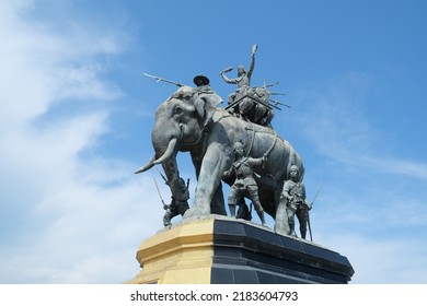 Ayutthaya, Thailand - July 28, 2022: Queen Suriyothai Monument, That Depicts A Fierce Looking King Maha Chakkraphat On His War Elephant, Surrounded By Siamese Soldiers With Clouds And Blue Sky.