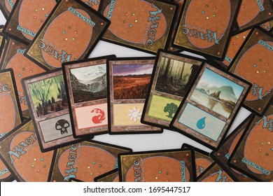 AYUTTHAYA,THAILAND-APRIL 6, 2020 : FIVE LAND FOR MTG GAME CARDS ON THE BACK CARD MAGIC THE GATHERING CARD BACKGROUD