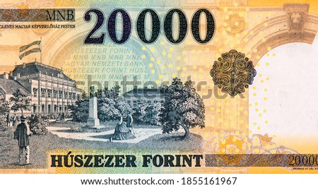 Az Ideiglenes Magyar Kepviselohaz Pesten (The Provisional Assembly of Hungary in Budapest) building with flag, trees, strolling couples, and statue of bust. from Hungary 20000 Forint 2004 Banknotes.  Stock fotó © 