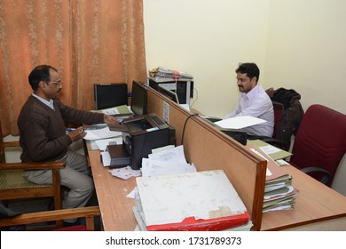 Azamgarh, Uttar Pradesh/India- May 14 2020: People Working At A Office To Do The Critical Work While Maintaining Social Distancing.