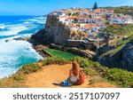 Azenhas do Mar, back view of woman tourist in Sintra, Portugal