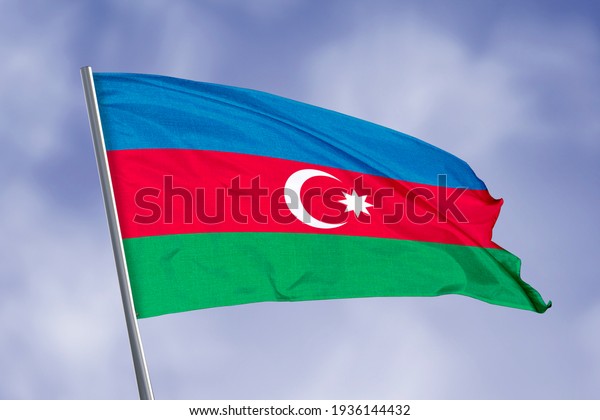 Azerbaijan flag\
isolated on sky background. close up waving flag of Azerbaijan.\
flag symbols of\
Azerbaijan.
