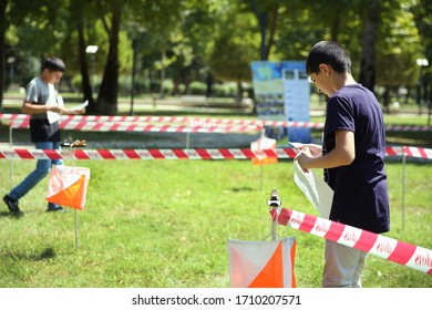 Azerbaijan, Ismayilli 26.08.2016: Outdoor Orienteering Check Point Activity . Line At An Orienteering . Person Racing To An Orienteering Check Point, Put The Finger Chip Into Digital Check Box