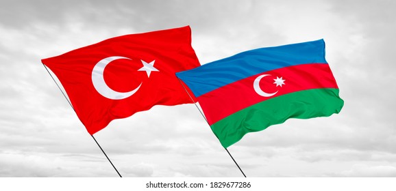 Azerbaijan And Turkey Flags Waving In The Dawn Sky