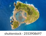 Azores aerial amazing view. Top view of Islet of Vila Franca do Campo. Crater of an old underwater volcano. San Miguel island, Azores, Portugal. Heart carved by nature. Bird eye view.