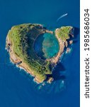 Azores aerial panoramic view. Top view of Islet of Vila Franca do Campo. Crater of an old underwater volcano. San Miguel island, Azores, Portugal. Heart carved by nature. Bird eye view.