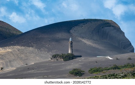 Azores, Island of Faial. The lighthouse Farol dos Capelinhos at Ponta dos Capelinos	