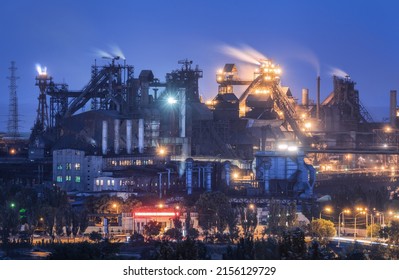 Azovstal in Mariupol, Ukraine before war. Steel plant at night. Steel factory with smokestacks. Steel works, iron works. Heavy industry. Industrial landscape with metallurgical combine, smokes, lights