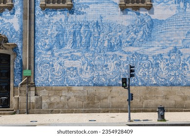 Azulejo tile in Porto, Portugal. Traditional portuguese ceramic decoration blue color. Historic building wall facade design.