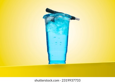 Azulito or little smurf. Azulito is a cocktail made of vodka, curacao, energetic drink and soda. It's served with ice in a garnished glass