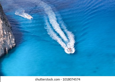 Azure bay with boats in Greek sea.