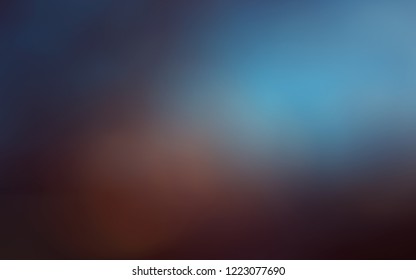 Azure glare surrounded by dusky violet blue and tawny brown background blur