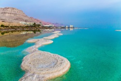 Azure Sea Water Is Full Of Healing Salts. Small Islets And Path Of Salt In The Water. Early Morning At The Resorts Of The Dead Sea. Israel. Concept Of Ecological, Medical And Photo Tourism