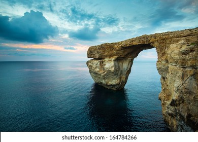 Azure Window, Natural Arch On Gozo Island, With Blue Sky And Clouds